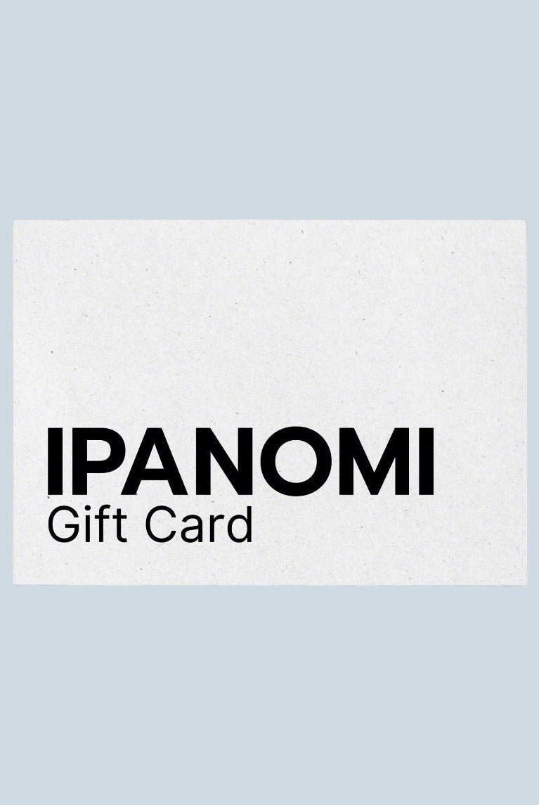 Ipanomi Gift Card with black text on a textured white background. Available in digital format.