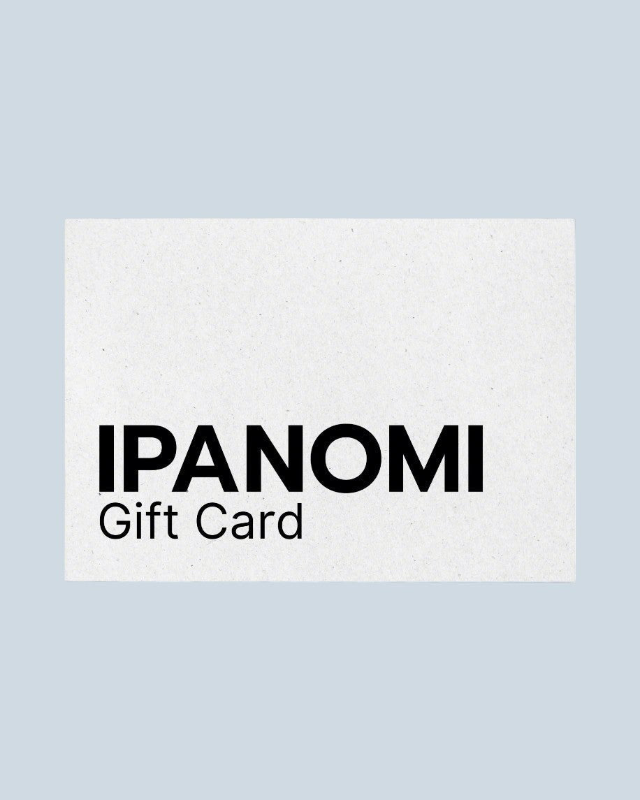 Ipanomi Gift Card with black text on a textured white background. Available in digital format.