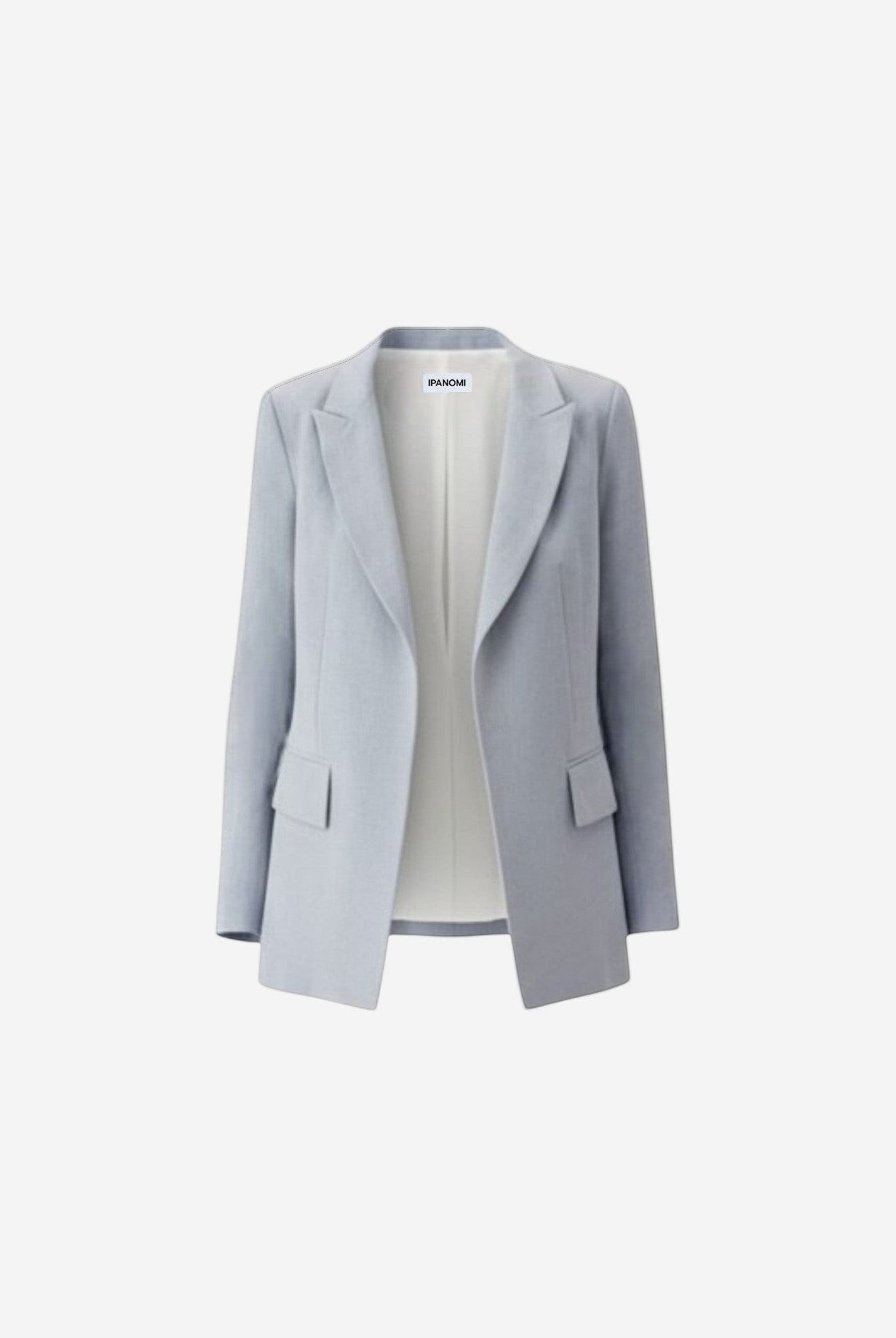 Ipanomi light blue linen tailored blazer with flap pockets and a cream pleated skirt. OEKO-TEX certified.