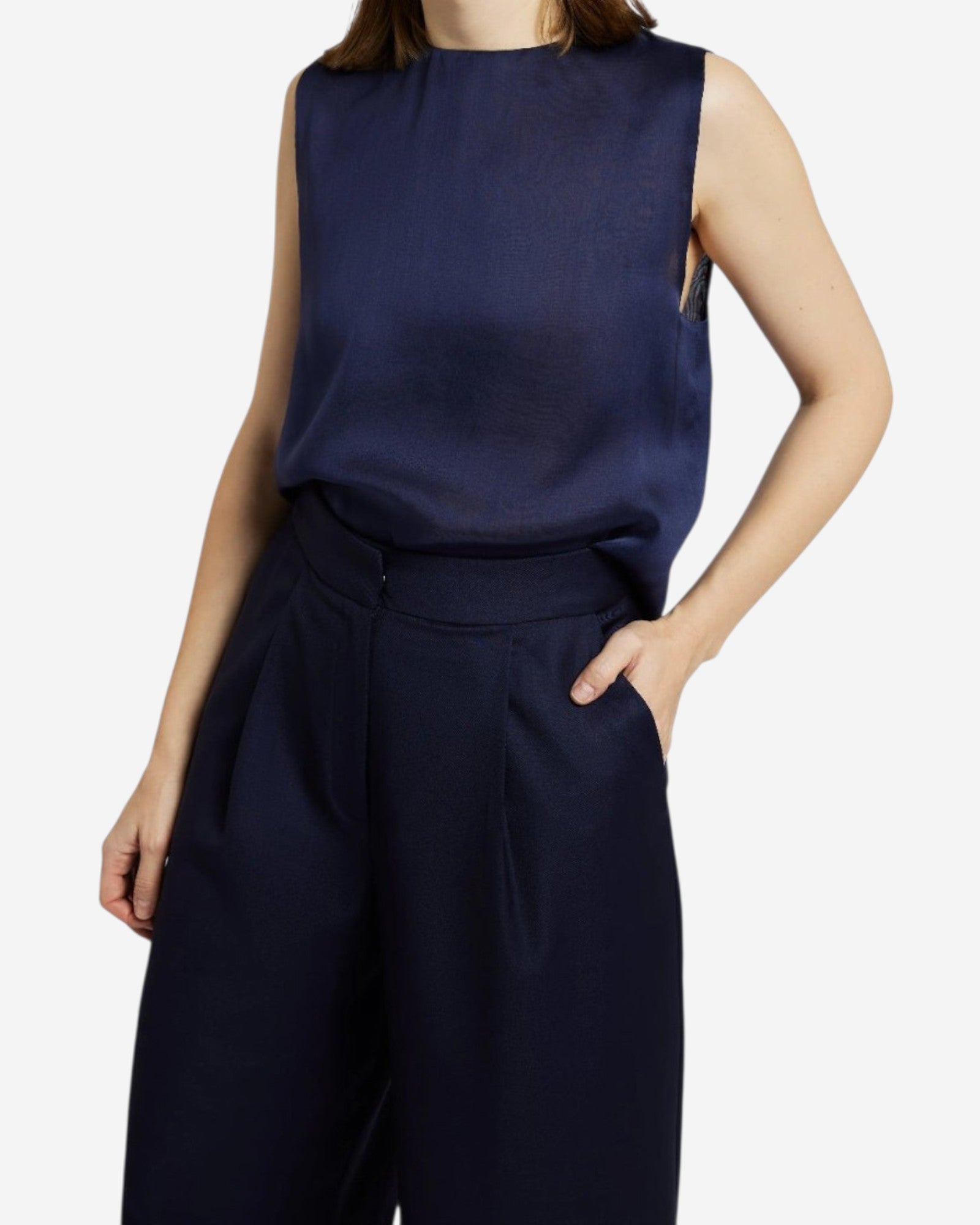 Ipanomi navy blue silk sleeveless top with a round neckline and relaxed fit, paired with matching trousers.