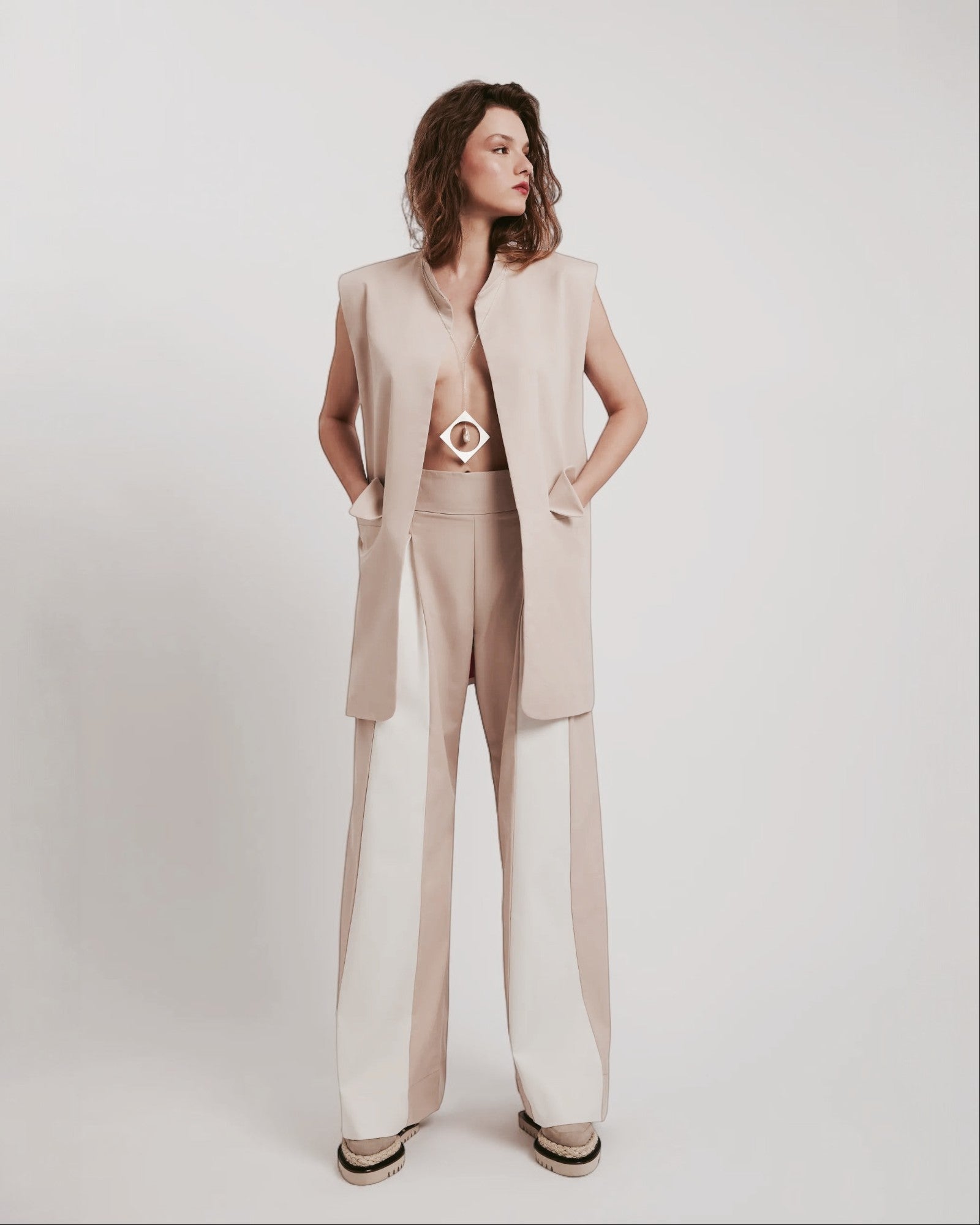 Ipanomi beige cotton twill wide-leg trousers with contrasting cream panels and a high waist.