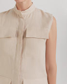 Ipanomi beige linen midi dress with mandarin collar, sleeveless, button-up front, and cargo pockets.