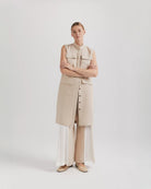 Ipanomi beige linen midi dress with mandarin collar, button front, patch pockets, and sleeveless design. Versatile cargo style.