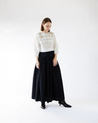 Ipanomi black organic cotton poplin maxi skirt with a high waist and structured waistband, perfect for city casual wear.