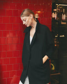 Ipanomi black oversized wool jacket with scarf collar and hidden snap closure. Side pockets.