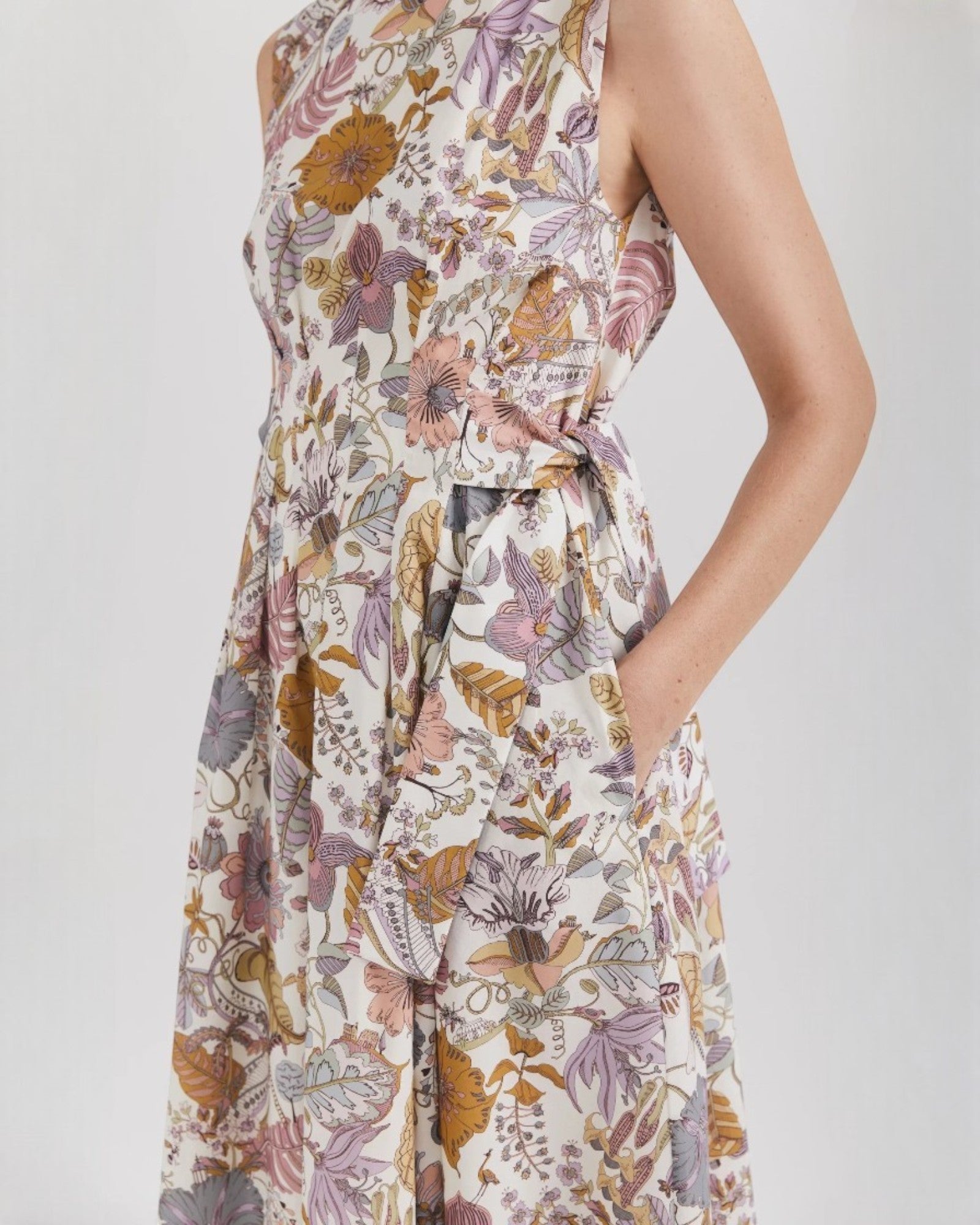 Ipanomi midi dress in Tana Lawn cotton with a floral print, sleeveless, with pockets and side ties.