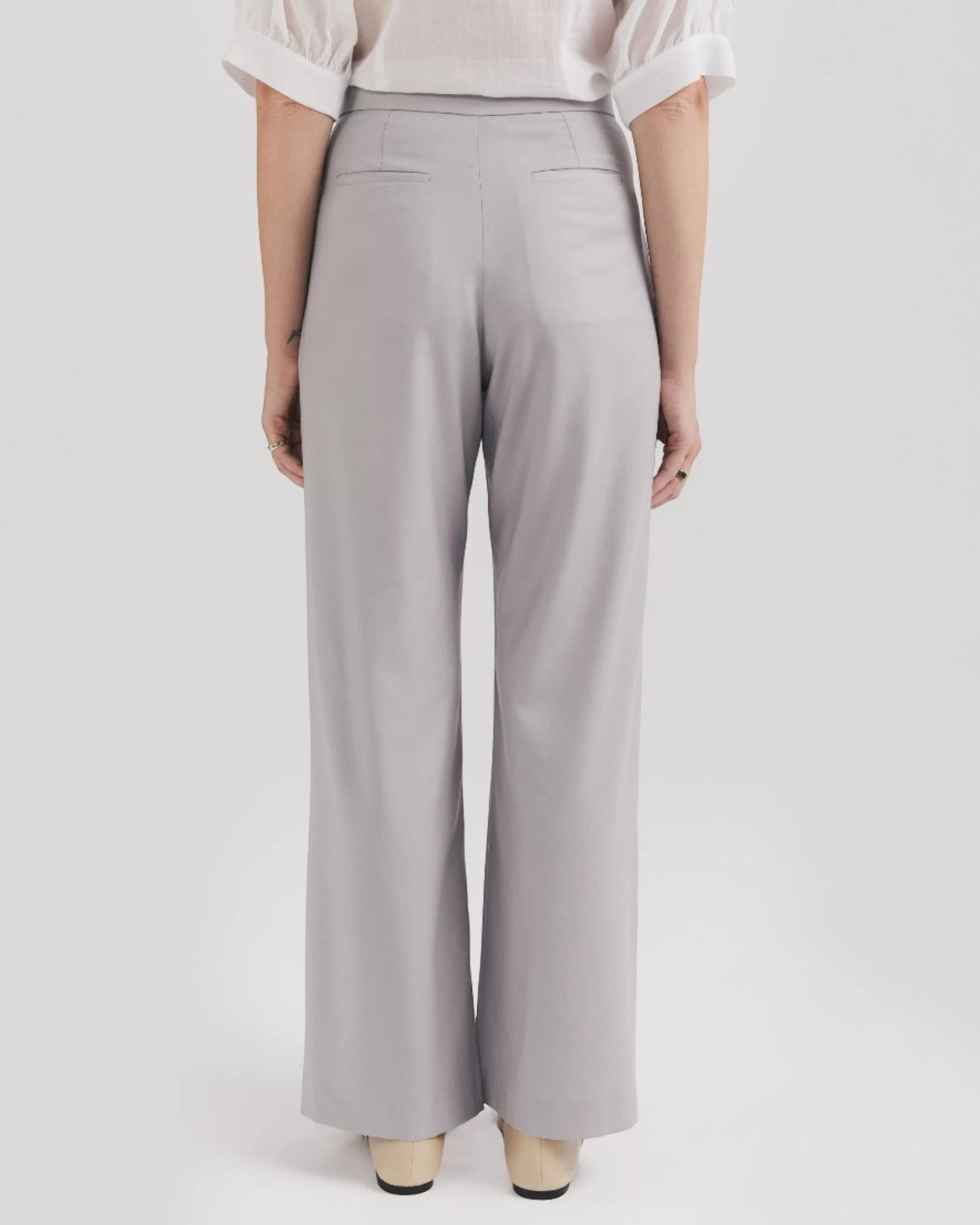 Ipanomi grey premium wool palazzo pants with double front pleats, side pockets, and back pockets.