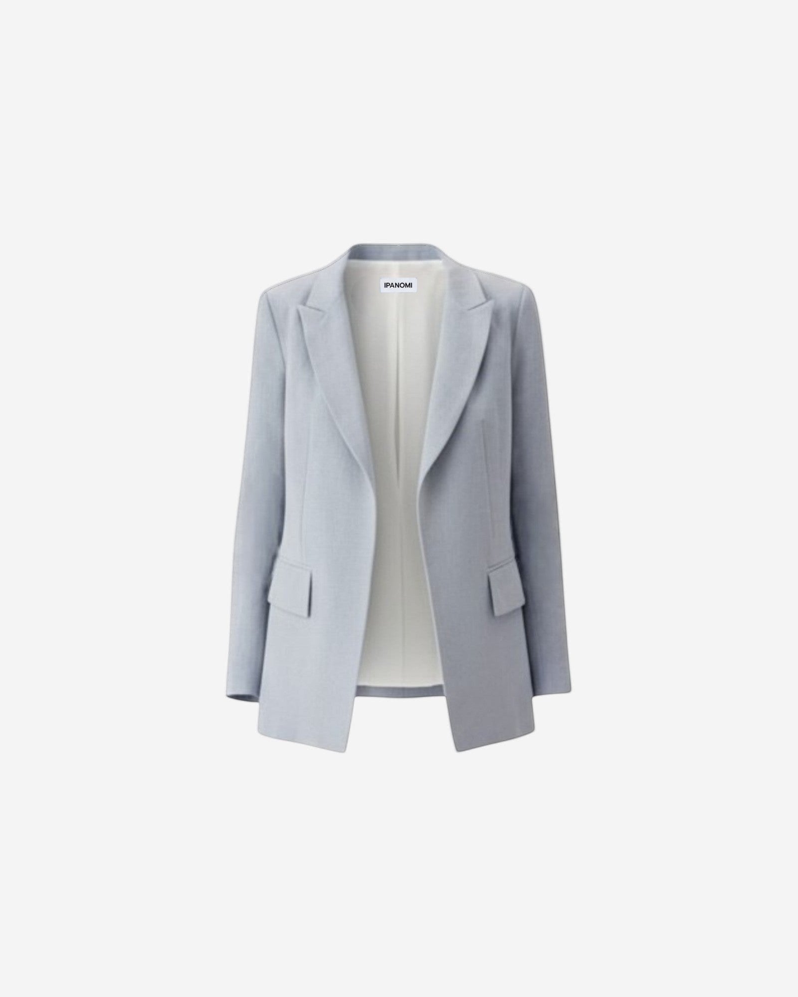Ipanomi light blue linen tailored blazer with flap pockets and a cream pleated skirt. OEKO-TEX certified.