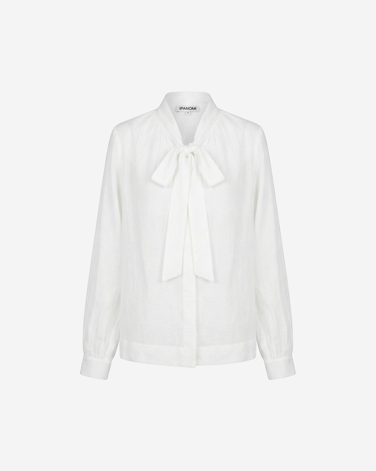 Ipanomi white cotton blouse with a tie neck detail and long sleeves, perfect for office or smart casual wear.
