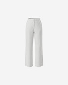 Ipanomi women's white linen trousers with black pinstripes, featuring a high waist, wide leg, and side pockets. Model is wearing size S.