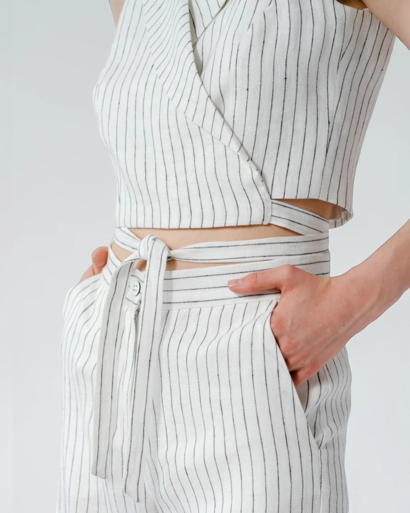 Ipanomi white pinstripe linen blend wrap crop top with tie waist detail.