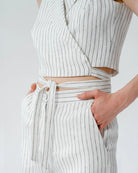 Ipanomi white pinstripe linen blend wrap crop top with tie waist detail.