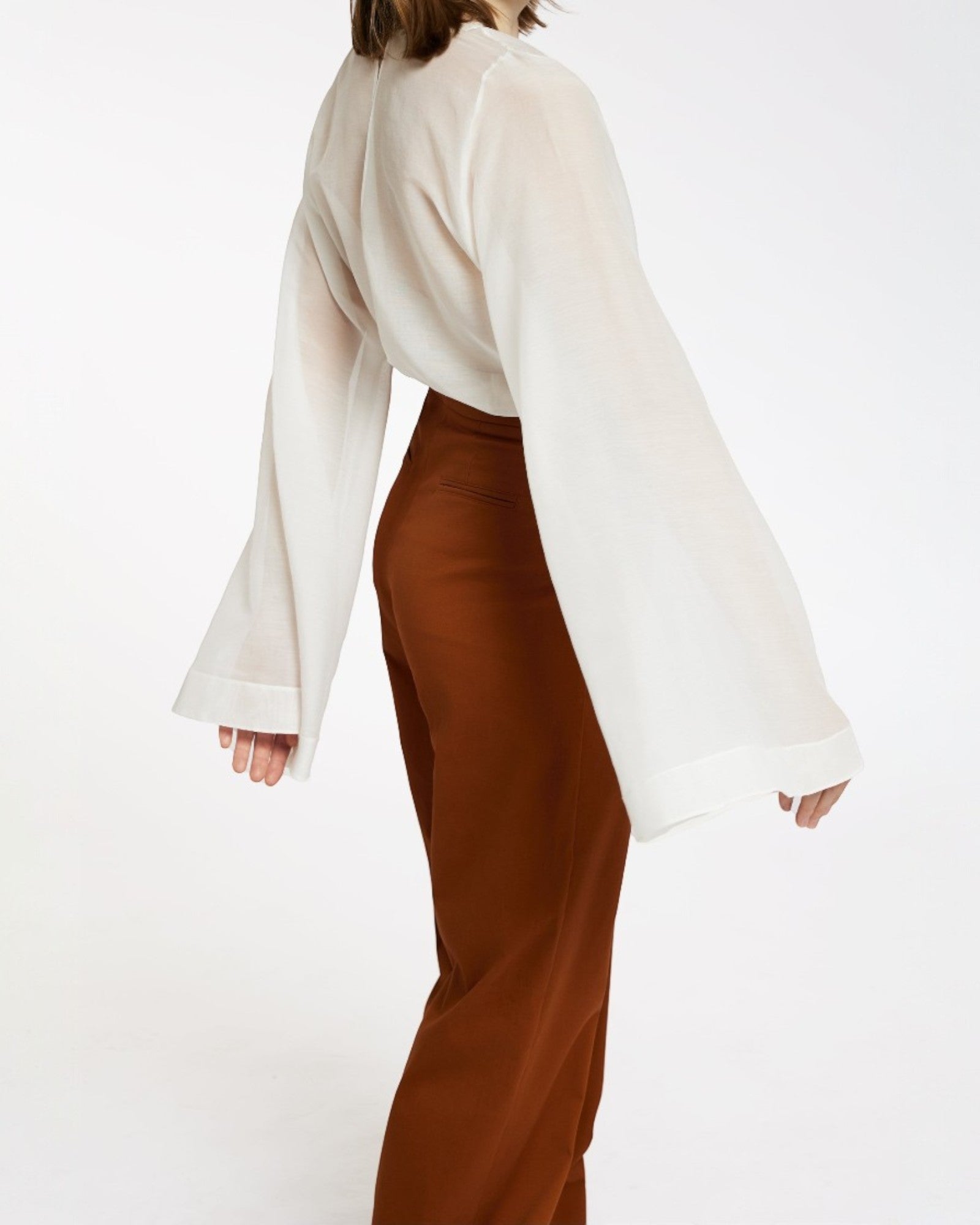 Ipanomi white silk and cotton blend top with elegant bell sleeves and a relaxed fit.