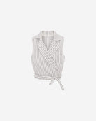 Ipanomi white linen wrap vest with fine black pinstripes, featuring a wide lapel and tie waist.